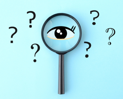 Eye clip art and magnifying glass with question marks