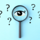 Eye clip art and magnifying glass with question marks